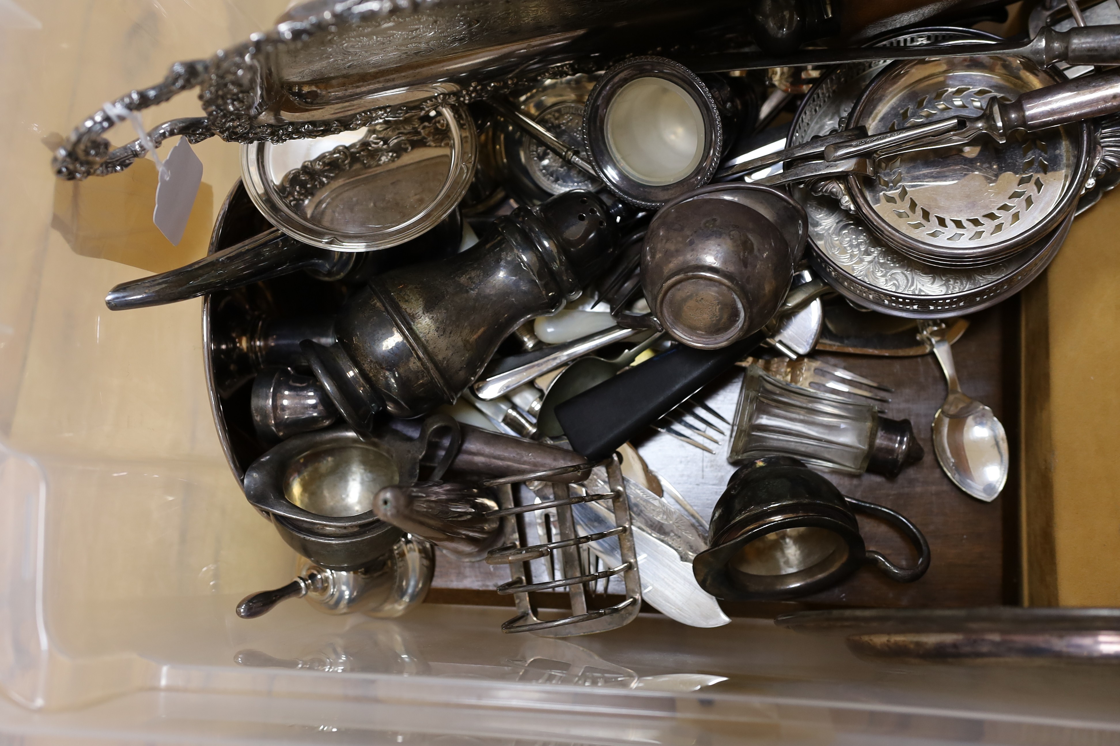 A large quantity of assorted plate wares including an Elkington & Co bottle pourer, a model yacht, two hip flasks, flatware, chambersticks, etc.